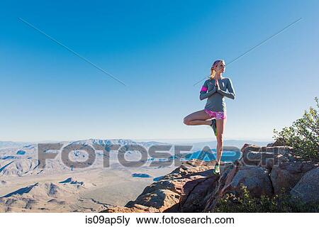"Young female trail runner doing yoga pose on Pacific Crest Trail, Pine Valley, California, USA" View Large Photo Image Stock Photo - "Young female trail runner doing yoga pose on Pacific Crest Trail, Pine Valley, California, USA". Fotosearch