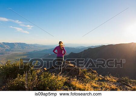 "Young female trail runner looking at view on Pacific Crest Trail, Pine Valley, California, USA" View Large Photo Image Stock Photography - "Young female trail runner looking at view on Pacific Crest Trail, Pine Valley, California, USA". Fotosearch