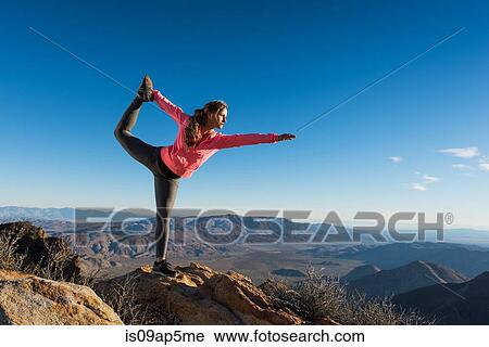 "Young female trail runner on Pacific Crest Trail doing yoga whilst looking out over landscape, Pine Valley, California, USA" View Large Photo Image Stock Image - "Young female trail runner on Pacific Crest Trail doing yoga whilst looking out over landscape, Pine Valley, California, USA". Fotosearch