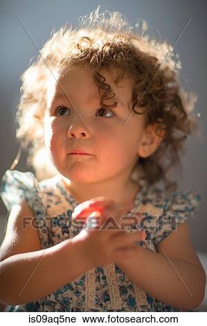 Stock Image - "Young girl, praying". Fotosearch