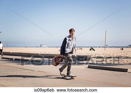 "Young man skateboarding, Santa Monica Pier, Santa Monica Beach, US" View Large Photo Image Stock Image - "Young man skateboarding, Santa Monica Pier, Santa Monica Beach, US". Fotosearch