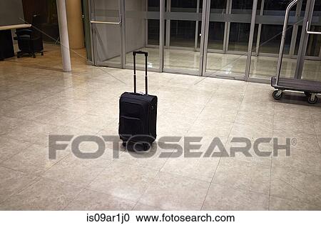 Stock Image - Abandoned luggage in building. Fotosearch