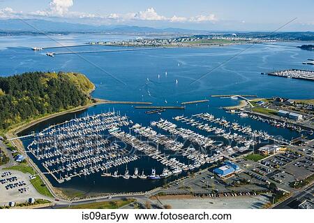 Stock Photo - Aerial view of rows of yachts moored in coastal marina. Fotosearch