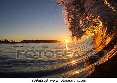 "Barrelling wave at sunset, Hawaii" View Large Photo Image Stock Photo - "Barrelling wave at sunset, Hawaii". Fotosearch