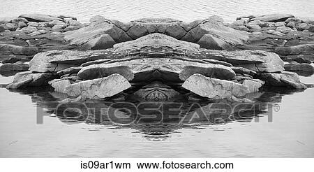 Black and white symmetrical detail of rocks and sea View Large Photo Image Picture - Black and white symmetrical detail of rocks and sea. Fotosearch