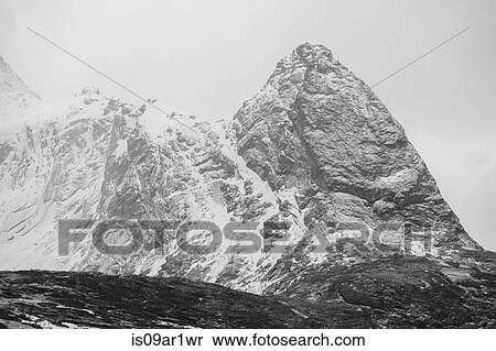 "Black and white view of snow capped mountains, Reine, Lofoten, Norway" View Large Photo Image Stock Photography - "Black and white view of snow capped mountains, Reine, Lofoten, Norway". Fotosearch