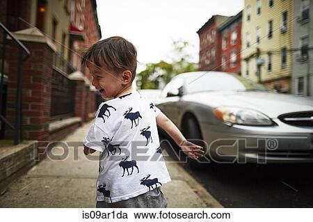 Boy running down street View Large Photo Image Stock Image - Boy running down street. Fotosearch