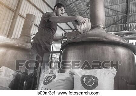 Brewer looking into brewing machine View Large Photo Image Stock Image - Brewer looking into brewing machine. Fotosearch