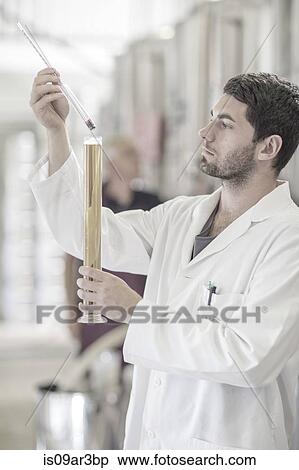 Stock Photography - Brewer testing the beer in the brewery. Fotosearch