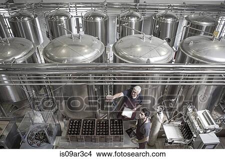 Picture - Brewers in brewery. Fotosearch