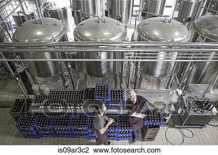Stock Image - Brewers in brewery. Fotosearch