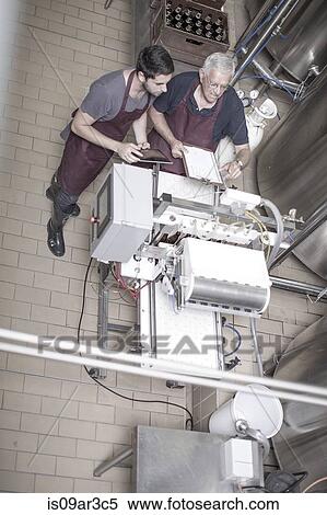 Stock Photography - Brewers in brewery. Fotosearch
