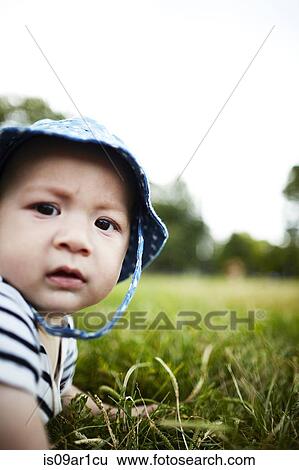 Close up portrait of baby boy looking at camera View Large Photo Image Stock Photograph - Close up portrait of baby boy looking at camera. Fotosearch