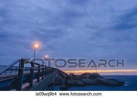 Picture - "Coastal crossing at dusk, Reine, Lofoten, Norway". Fotosearch
