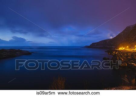 Picture - "Coastline at night, Reine, Lofoten, Norway". Fotosearch