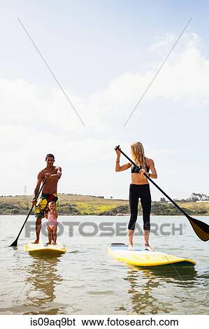 "Couple and toddler daughter standup paddleboarding, Carlsbad, California, USA" View Large Photo Image Stock Photograph - "Couple and toddler daughter standup paddleboarding, Carlsbad, California, USA". Fotosearch