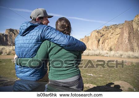 Stock Image - "Couple enjoying scenery, Smith Rock State Park, Oregon". Fotosearch