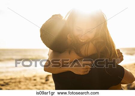 Stock Photography - "Couple having fun on beach, Malibu, California, USA". Fotosearch