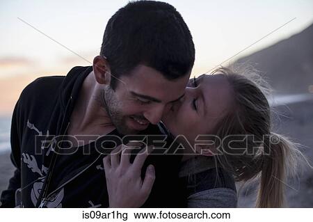 "Couple hugging on beach, Malibu, California, USA" View Large Photo Image Stock Image - "Couple hugging on beach, Malibu, California, USA". Fotosearch