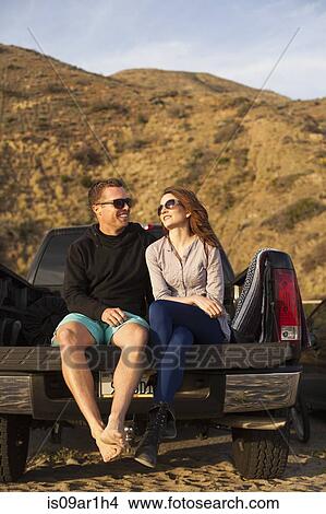 "Couple on beach, Malibu, California, USA" View Large Photo Image Picture - "Couple on beach, Malibu, California, USA". Fotosearch