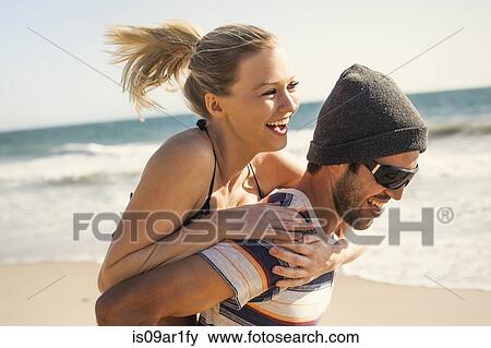 "Couple on vacation at beach, Malibu, California, USA" View Large Photo Image Stock Photo - "Couple on vacation at beach, Malibu, California, USA". Fotosearch