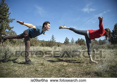 "Couple practising yoga, Smith Rock State Park, Oregon" View Large Photo Image Stock Image - "Couple practising yoga, Smith Rock State Park, Oregon". Fotosearch