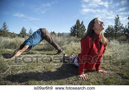 "Couple practising yoga, Smith Rock State Park, Oregon" View Large Photo Image Stock Photo - "Couple practising yoga, Smith Rock State Park, Oregon". Fotosearch