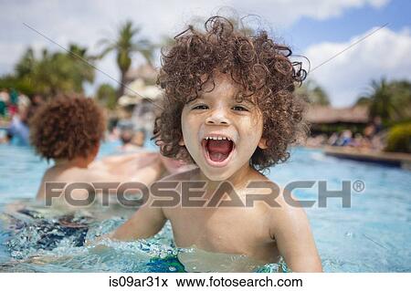"Cute boy playing in swimming pool with brother, Destin, Florida, USA" View Large Photo Image Stock Photo - "Cute boy playing in swimming pool with brother, Destin, Florida, USA". Fotosearch