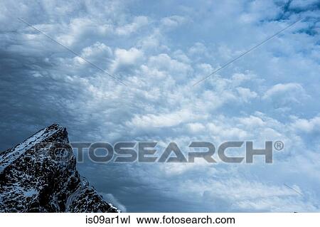 "Detail of mountain top and storm clouds, Reine, Lofoten, Norway" View Large Photo Image Stock Image - "Detail of mountain top and storm clouds, Reine, Lofoten, Norway". Fotosearch