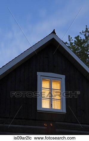 "Exterior of log house, room illuminated by light, dusk" View Large Photo Image Stock Image - "Exterior of log house, room illuminated by light, dusk". Fotosearch