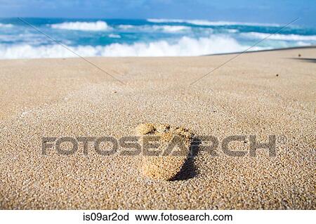 Stock Image - "Footprint in sand, close-up". Fotosearch