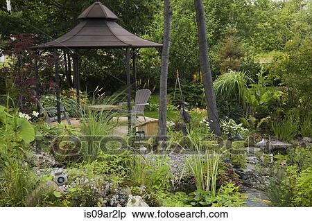 Stock Photography - Gazebo in ornamental garden in summer. Fotosearch
