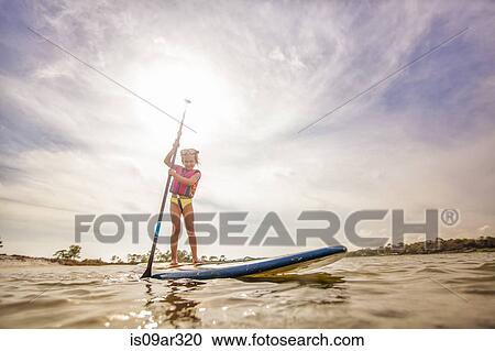 "Girl standup paddleboarding in the sound, Fort Walton, Florida, USA" View Large Photo Image Stock Image - "Girl standup paddleboarding in the sound, Fort Walton, Florida, USA". Fotosearch