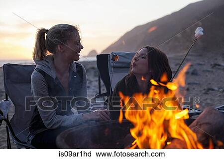 "Girlfriends having barbecue on beach, Malibu, California, USA" View Large Photo Image Stock Image - "Girlfriends having barbecue on beach, Malibu, California, USA". Fotosearch