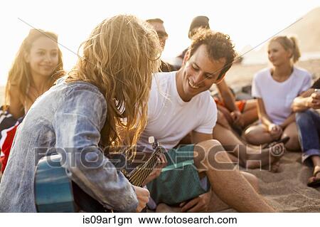 Group of friends camping on beach View Large Photo Image Picture - Group of friends camping on beach. Fotosearch