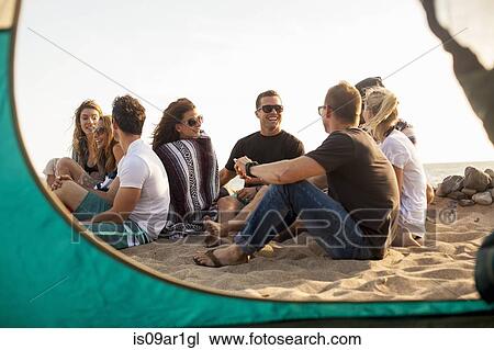 Group of friends camping on beach View Large Photo Image Stock Image - Group of friends camping on beach. Fotosearch