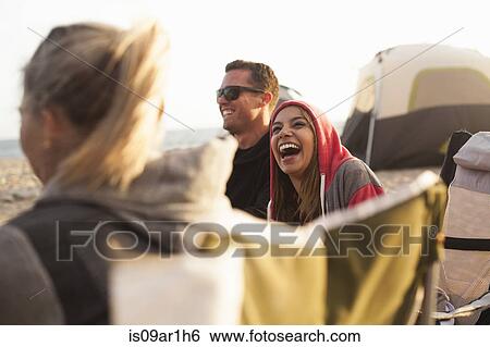 Group of friends camping on beach View Large Photo Image Stock Photograph - Group of friends camping on beach. Fotosearch
