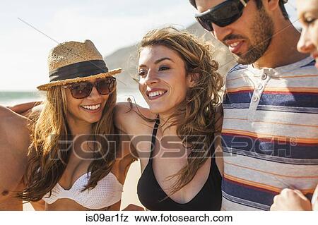 Group of friends on vacation at beach View Large Photo Image Stock Photo - Group of friends on vacation at beach. Fotosearch