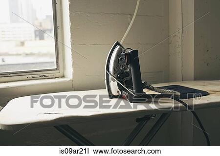 Iron and ironing board in fashion studio View Large Photo Image Stock Image - Iron and ironing board in fashion studio. Fotosearch