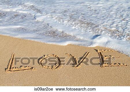 Stock Image - "Love, written in sand, close-up". Fotosearch