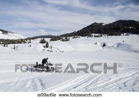 "Man on snowmobile, Jackson Hole, Wyoming" View Large Photo Image Stock Image - "Man on snowmobile, Jackson Hole, Wyoming". Fotosearch