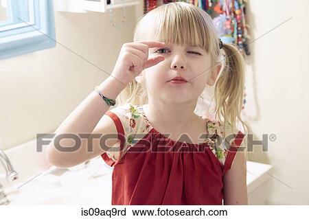 "Portrait of young girl, looking through fingers" View Large Photo Image Stock Image - "Portrait of young girl, looking through fingers". Fotosearch