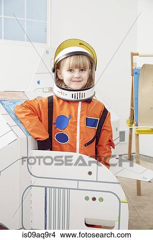 Picture - "Portrait of young girl, wearing astronaut outfit". Fotosearch