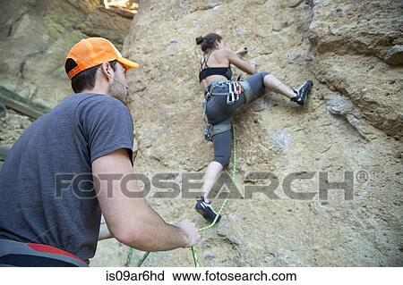 Stock Image - "Rock climber scaling rock, Smith Rock State Park, Oregon". Fotosearch
