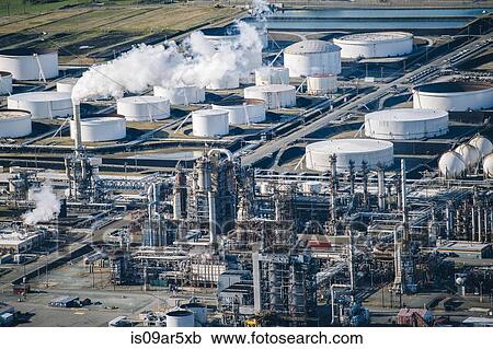 Rows of white oil storage tanks and smoke stack in oil refinery View Large Photo Image Stock Image - Rows of white oil storage tanks and smoke stack in oil refinery. Fotosearch