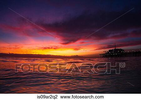 Stock Image - "Santa Monica PIer and ocean, sunset, California, USA". Fotosearch