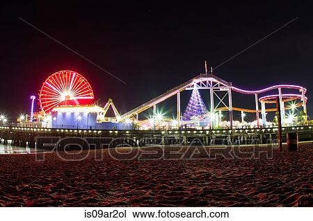 Stock Image - "Santa Monica Pier, illuminated at night, California, USA". Fotosearch