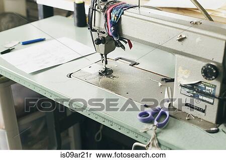 Sewing machine and scissors in fashion studio View Large Photo Image Stock Photography - Sewing machine and scissors in fashion studio. Fotosearch