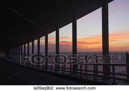 "Silhouetted bridge and sea at dusk, Reine, Lofoten, Norway" View Large Photo Image Stock Image - "Silhouetted bridge and sea at dusk, Reine, Lofoten, Norway". Fotosearch