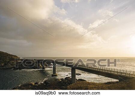 "Silhouetted bridge on coastline, Reine, Lofoten, Norway" View Large Photo Image Stock Image - "Silhouetted bridge on coastline, Reine, Lofoten, Norway". Fotosearch